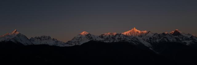 Alpenglow of the sunrise at Meili snow mountains